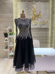 A captivating mauve, double-cloche dress with a flattering waistline, perfect for a special occasion.exclamation